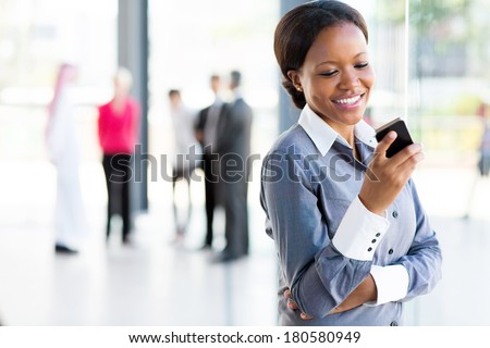 happy african american career woman using cell phone