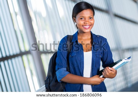 happy female african american college student on campus