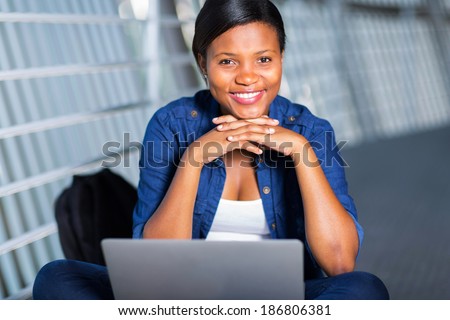 beautiful young african college student with laptop