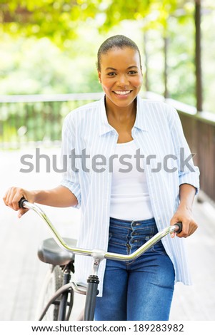 Image, Stock Photo Ethnic woman with bicycle on street