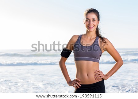young pretty fit woman portrait on beach