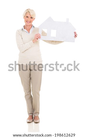 portrait of happy middle age woman holding paper house