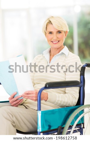 beautiful disabled mid age woman reading a book