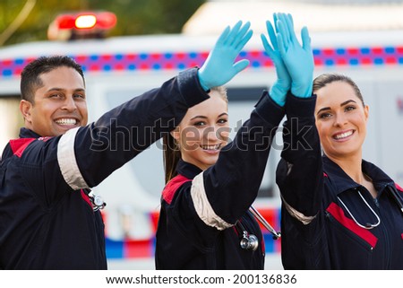 cheerful paramedic team high five