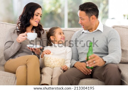 happy family relaxing on the couch at home
