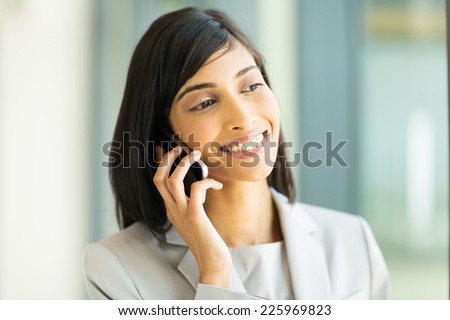 beautiful indian business executive making a phone call