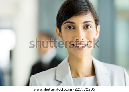 attractive young indian corporate worker in office