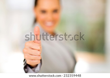 business woman giving thumb up
