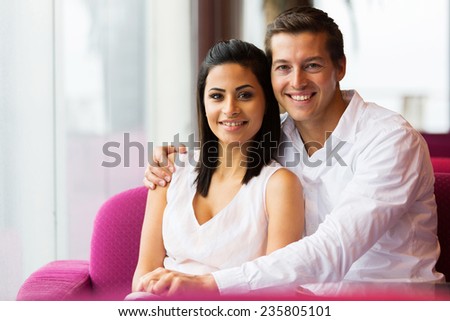 portrait of happy couple relaxing in coffee shop