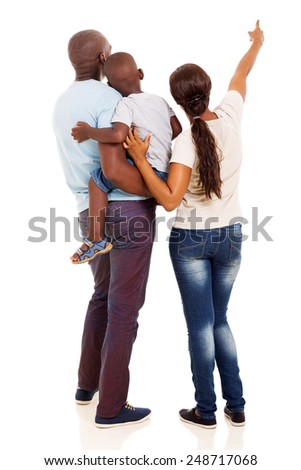 rear view of afro american young family pointing at empty space isolated on white background