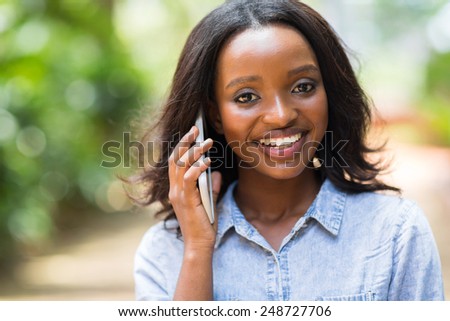 pretty female african american woman talking on mobile phone