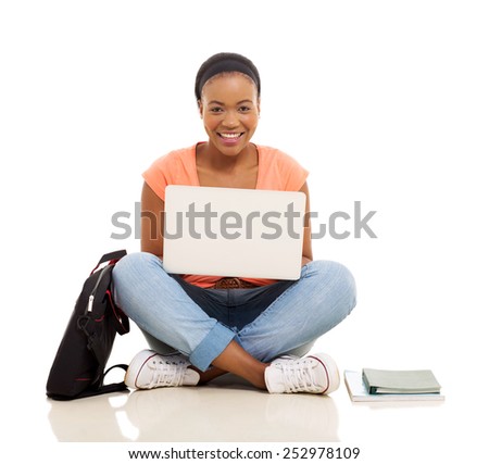 attractive female african college student using laptop isolated on white background