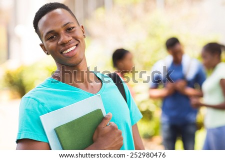 smiling young african male college student