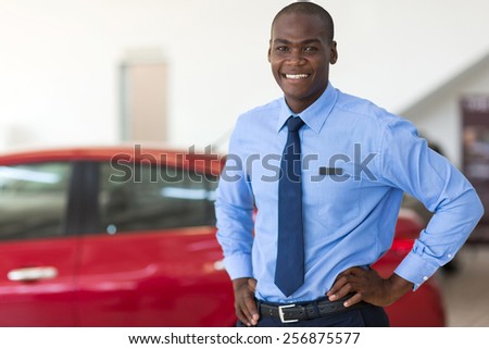 african american vehicle sales consultant inside showroom