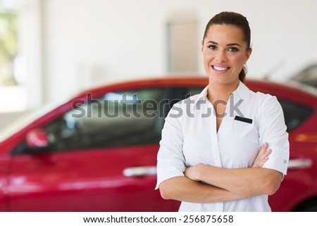 young female car sales consultant working in showroom
