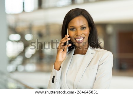 pretty african business woman making a phone call