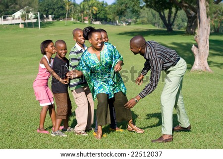 happy african family playing a game together