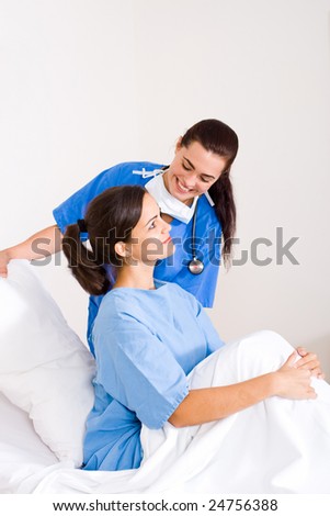 female doctor helping patient sitting up