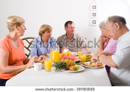 group of senior friends having breakfast
