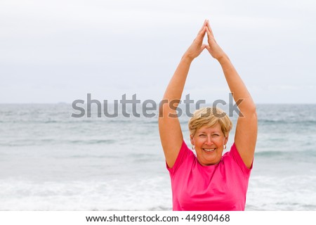 happy elderly lady doing fitness work out