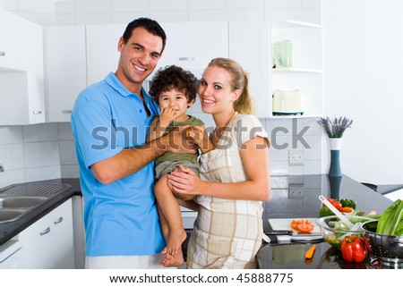 lovely young family in modern kitchen