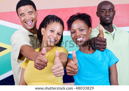 group of young happy South African people  in front of South Africa flag, 2010 FIFA world cup concept