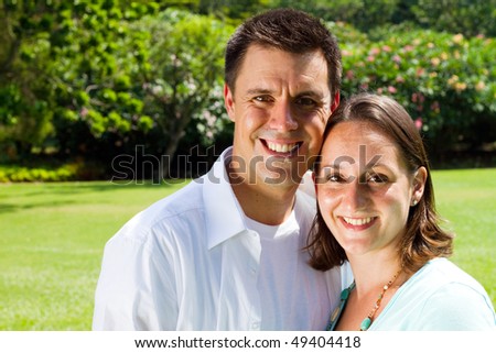 happy young couple in park