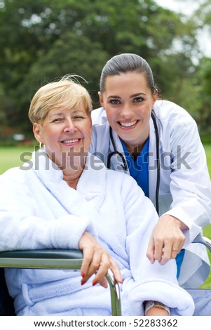 caring friendly doctor and happy senior patient portrait outdoors