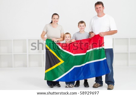 happy south african family with south africa flag
