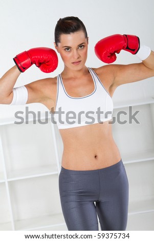 young fitness woman with boxing gloves