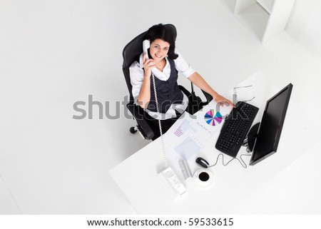 above view of young businesswoman working in office