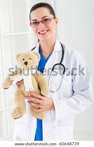 pediatrician with teddy bear