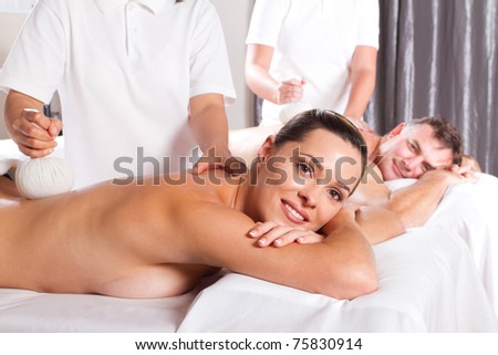 man and woman having Thai massage