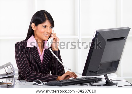 young indian businesswoman working in office
