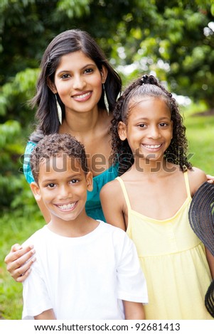 happy indian mother and children outdoors