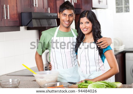 modern young  indian couple in kitchen