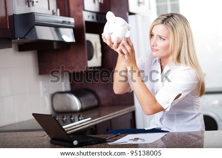 unhappy woman has no more money left to pay bills