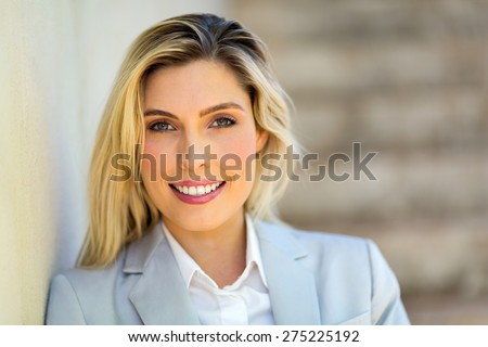 portrait of young career woman standing outdoors