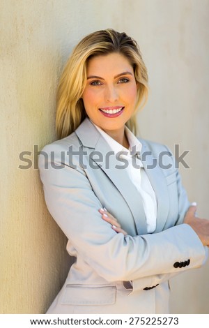 beautiful blonde woman with arms folded