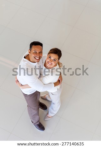 top view of middle aged couple in their new house
