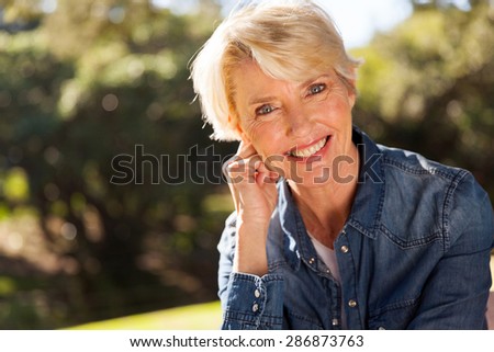 closeup portrait of middle aged woman outdoors