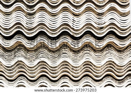 Old white concrete roof tile curve type stack on floor background