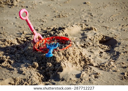 Color of Kid plastic sand toy on sand beach during day light