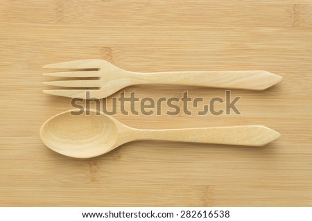 wood  spoon and wood fork on wood background