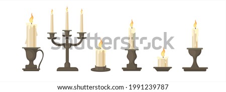 Set of vector cartoon vintage historical candles. Decorative candle for home. Fire and light.