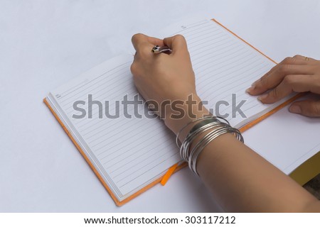 handwriting, hand writes a pen in a notebook