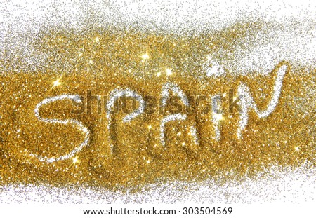 Blurry inscription Spain on golden glitter sparkles on white background