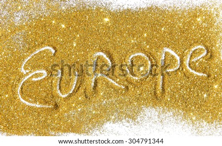 Inscription Europe on golden glitter sparkles on white background