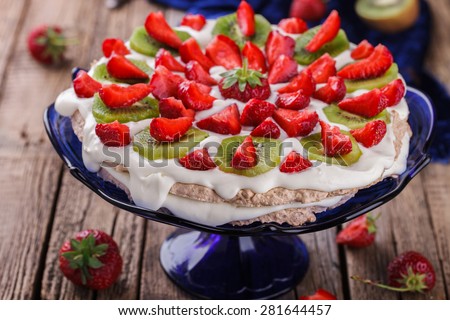 Cake meringue cakes with strawberries and kiwi.selective focus