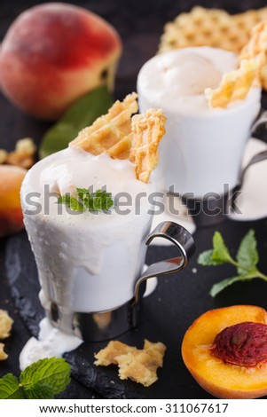 Peach  ice cream with mint, selective focus